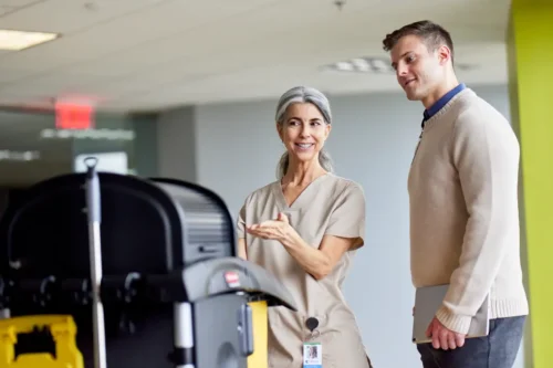 This image is for an EVS related blog taking about cleaning and patient experience. It hightlights a housekeeper and patient experience manager,