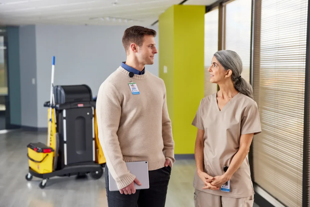Housekeeper and manager discussing plans for the day.